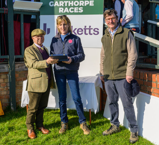 Anna Saunders is presented with a gift in recognition of her many years of service as Area Secretary